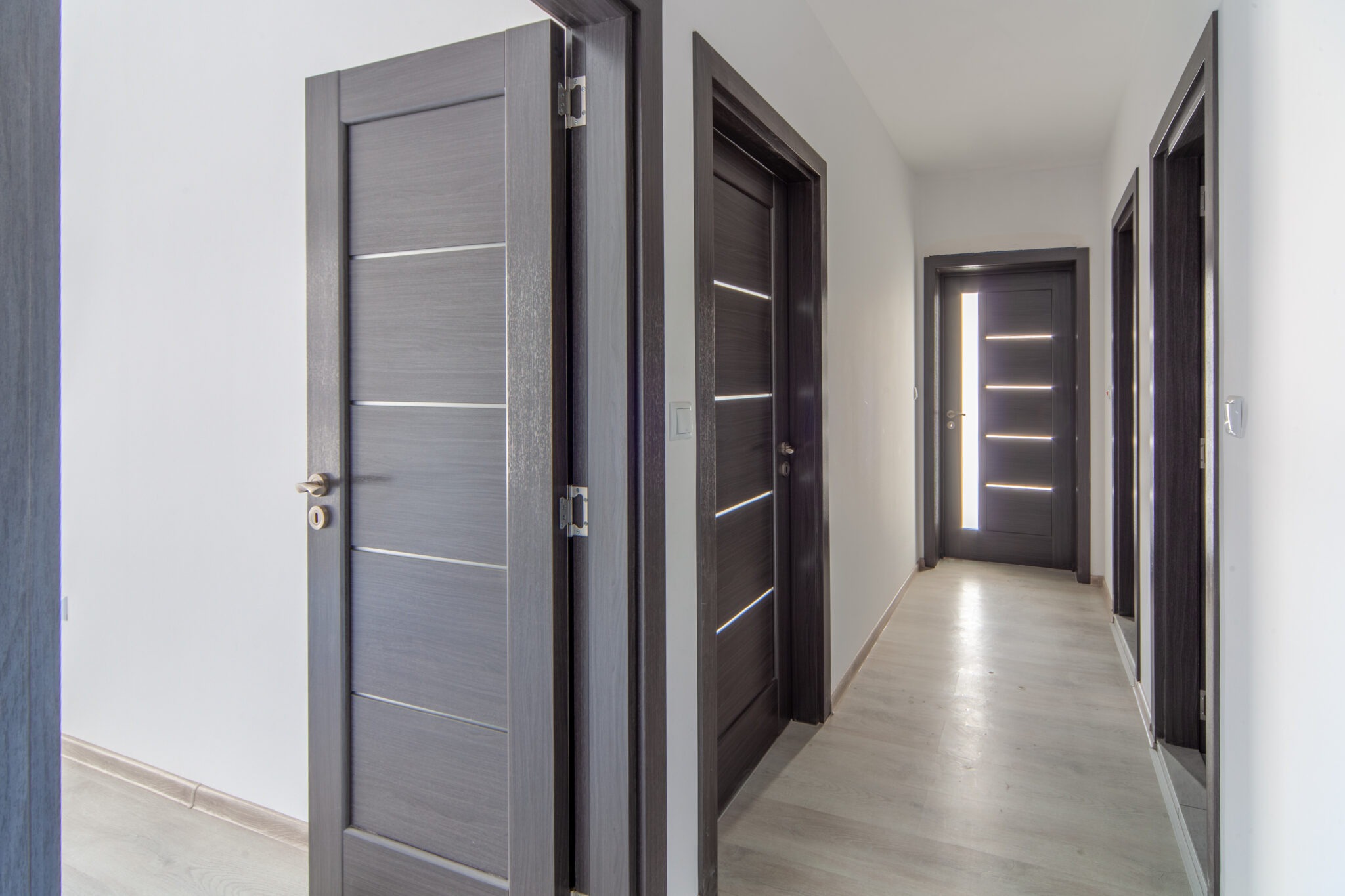 Modern home corridor with doors. Hallway in new apartment. New h
